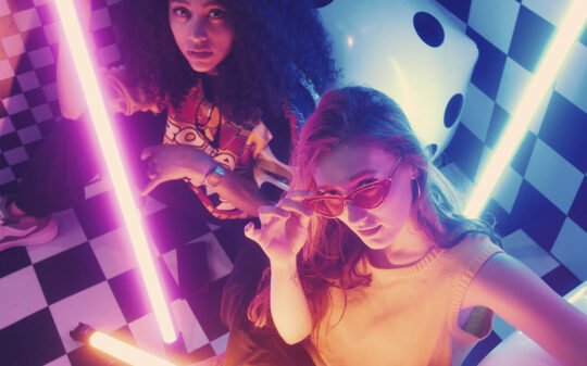 urban-girls-between-bars-of-colored-light